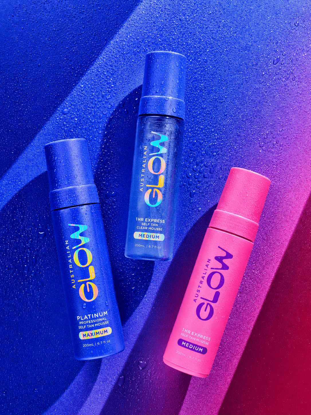 Australian Glow range — Clear Mousse alongside Platinum and the Pink Express on a navy-to-pink studio gradient
