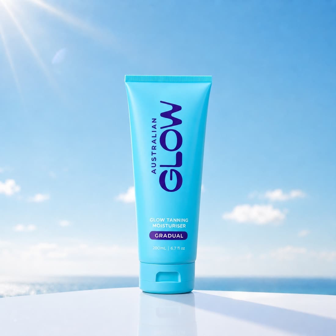 Gradual Glow Tanning Moisturiser poolside above the ocean