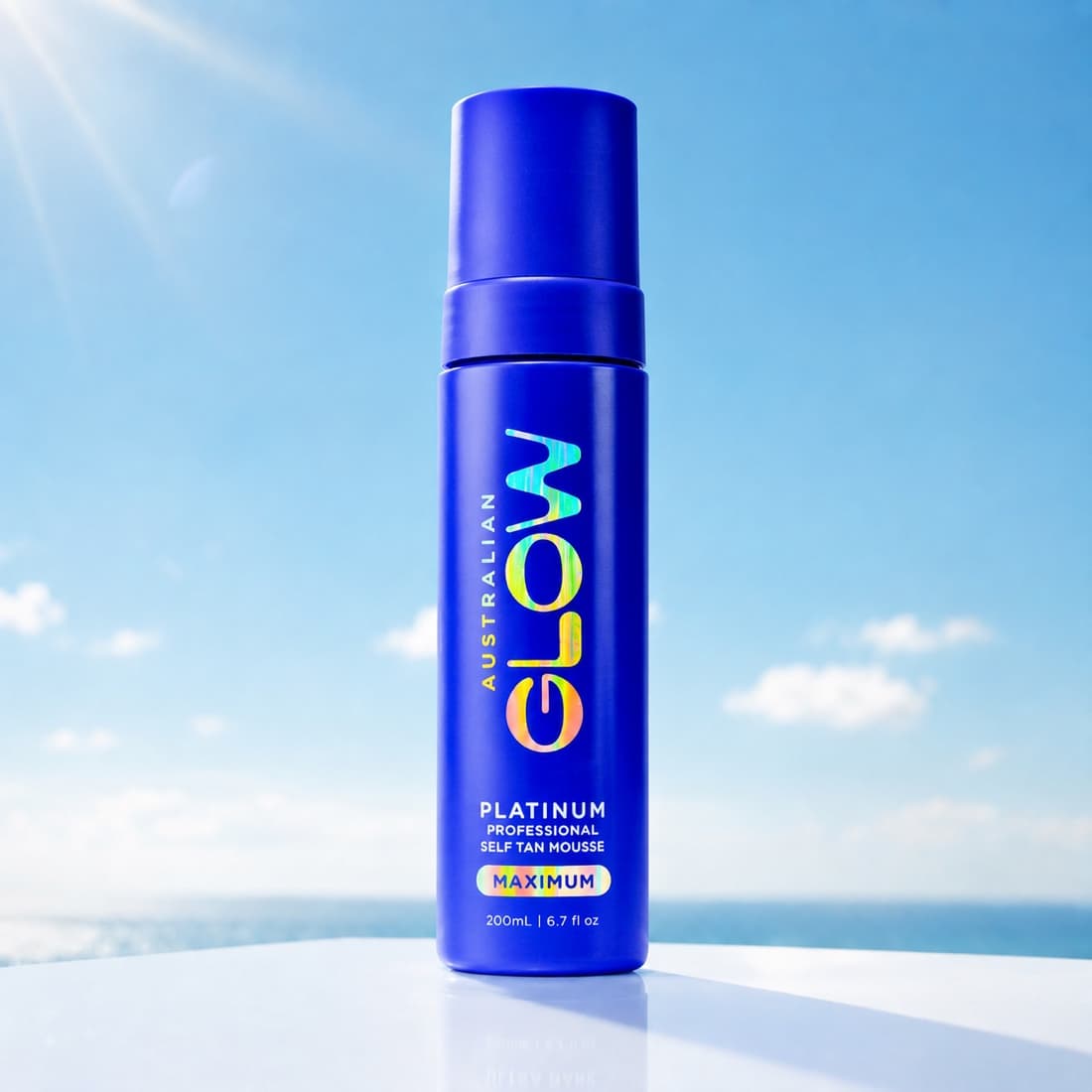 Platinum Professional Self Tan Mousse on a plinth above the ocean